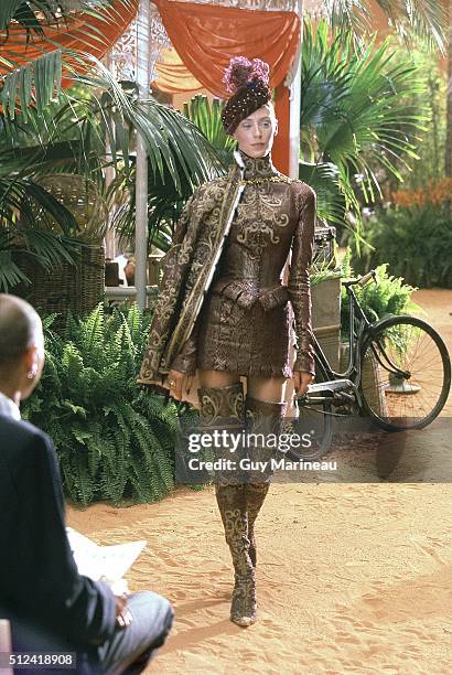 Model on the runway for the Fall/Winter 1998 Christian Dior Orient Express couture collection designed by John Galliano, wearing a sixteenth century...