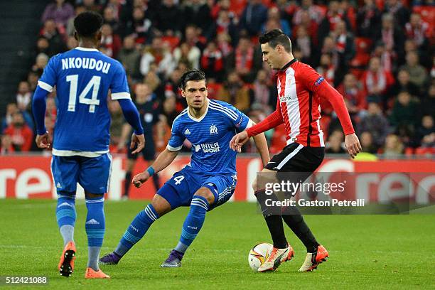 Karim Rekik of Marseille and Aritz Aduriz of Bilbao during the UEFA Europa League Round of 32, Second Leg match between Athletic Bilbao v Marseille...