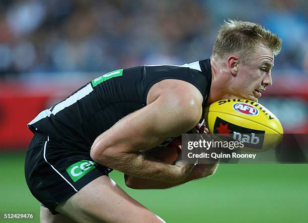 Jonathon Marsh of the Magpies marks during the 2016 NAB Challenge match between the Geelong Cats and the Collingwood Magpies at Simonds Stadium on...