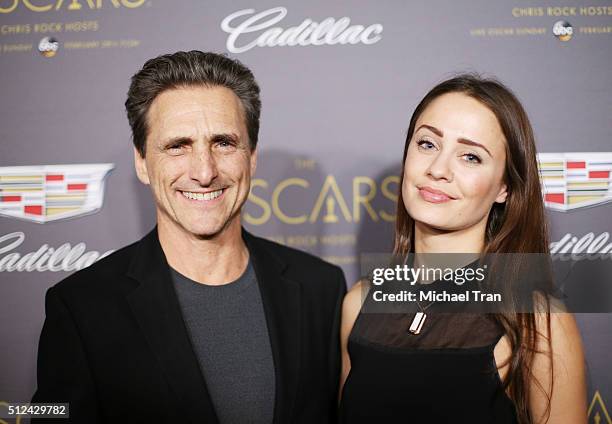 Lawrence Bender and guest arrive at the Cadillac celebrates The 88th Annual Academy Awards pre-party held at Chateau Marmont on February 25, 2016 in...