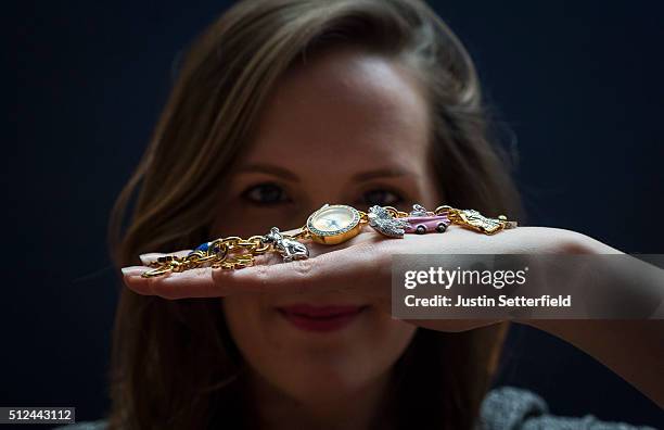 Sotheby's employee holds an Elvis themed watch bought in Graceland which is part of The Duchess collection of Elvis Presley ephemera during the...