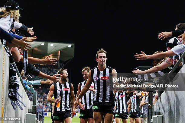 Steele Sidebottom of the Magpies celebrates the win with fans during the 2016 NAB Challenge match between the Geelong Cats and the Collingwood...