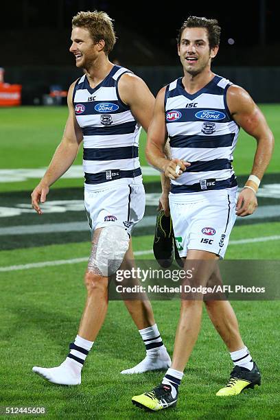 Lachie Henderson of the Cats and Daniel Menzel walk off after defeat during the 2016 NAB Challenge match between the Geelong Cats and the Collingwood...