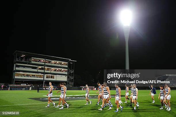 Cats players walk off after defeat during the 2016 NAB Challenge match between the Geelong Cats and the Collingwood Magpies at Simonds Stadium on...