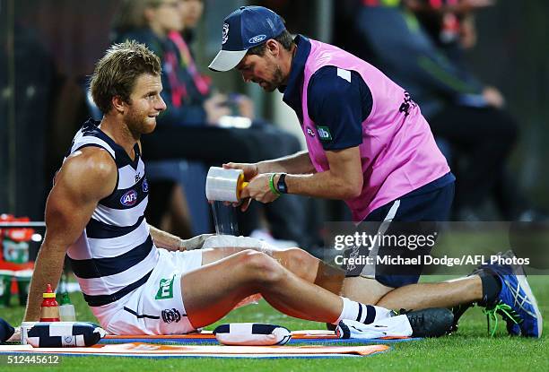 Lachie Henderson of the Cats gets his thigh strapped with ice during the 2016 NAB Challenge match between the Geelong Cats and the Collingwood...