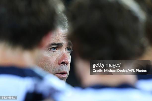 Cats head coach Chris Scott speaks to his players during the 2016 NAB Challenge match between the Geelong Cats and the Collingwood Magpies at Simonds...