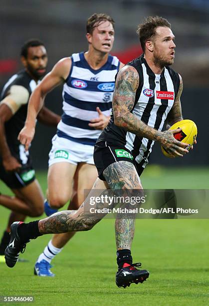 Dane Swan of the Magpies runs with the ball during the 2016 NAB Challenge match between the Geelong Cats and the Collingwood Magpies at Simonds...