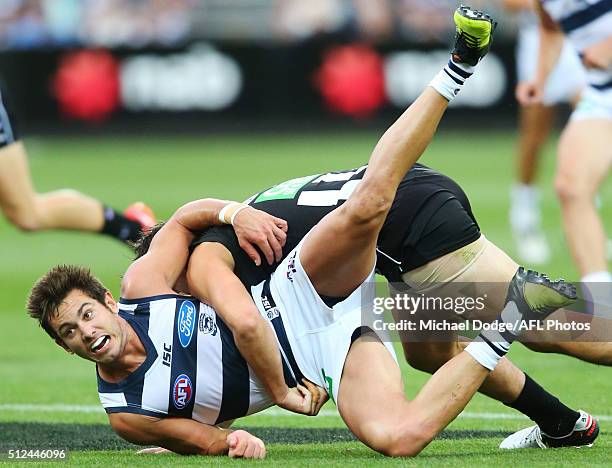 Daniel Menzel of the Cats gets tackled during the 2016 NAB Challenge match between the Geelong Cats and the Collingwood Magpies at Simonds Stadium on...