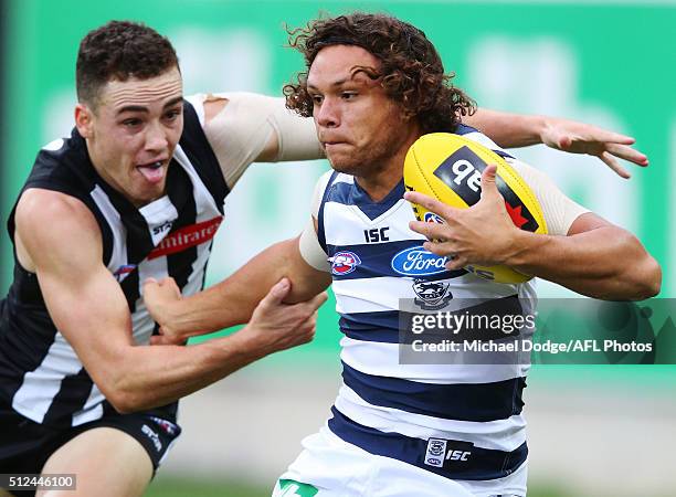 Steven Motlop of the Cats fends off Jackson Ramsay of the Magpies during the 2016 NAB Challenge match between the Geelong Cats and the Collingwood...