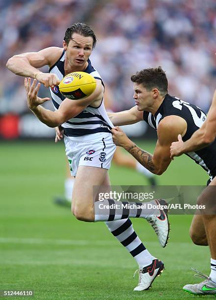 Patrick Dangerfield of the Cats handballs during the 2016 NAB Challenge match between the Geelong Cats and the Collingwood Magpies at Simonds Stadium...