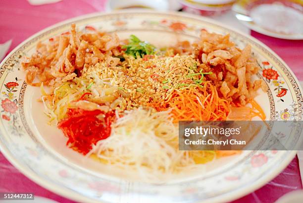 chinese yee sang - prosperity toss stock pictures, royalty-free photos & images