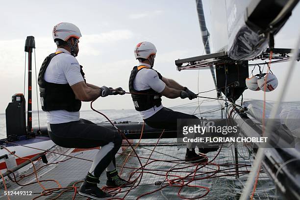 Thomas Le Breton and Devan Le Bihan maneuver Groupama Team France during a training session on the eve of the first day of races of the 35th...