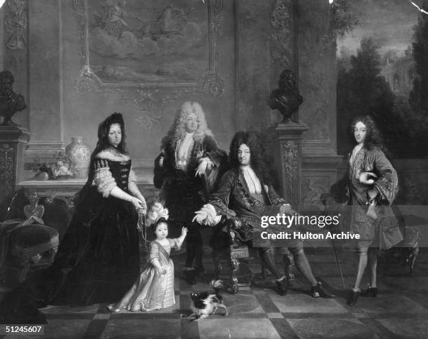 Circa 1710, King Louis XIV of France with his family. From left to right, the Duchess of Ventadour , the Duke of Anjou, later Louis XV), the Grand...