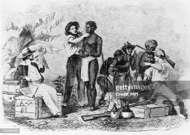 White traders inspect African enslaved people during a sale, circa 1850. Wood engraving by Whitney, Jocelyn & Annin from 'Captain Canot; or, Twenty...