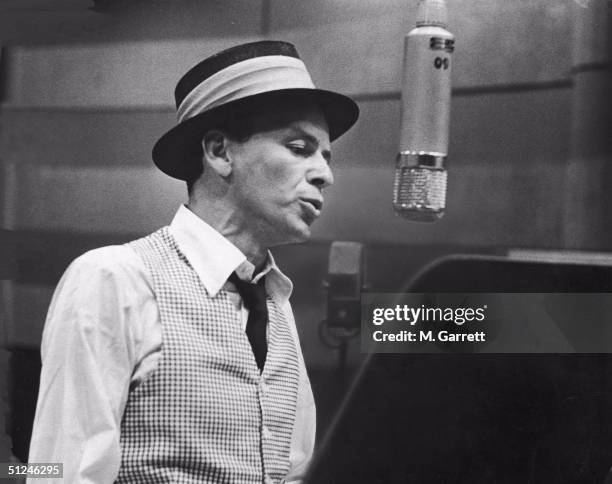 Circa 1953, American singer and actor Frank Sinatra during a recording session at Capitol Records.