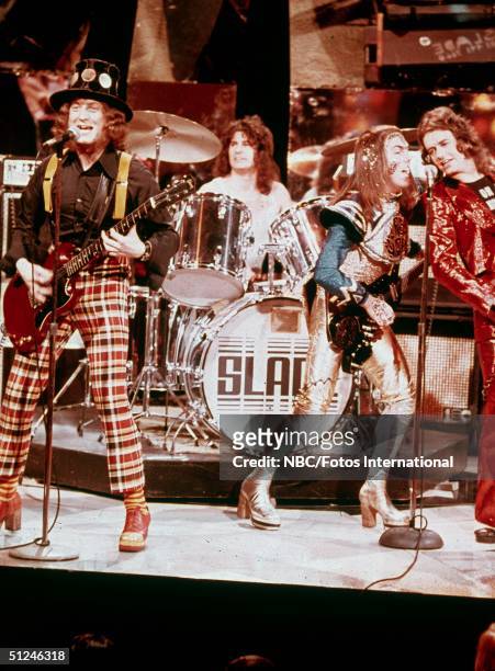 Circa 1975, British rock band Slade perform on stage for the television variety series 'The Midnight Special' 1970s. Left to right: singer Noddy...