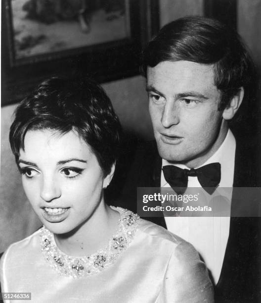 Circa 1967, American singer Liza Minnelli poses with her first husband Australian born actor Peter Allen at a formal event, late 1960s. Minnelli and...