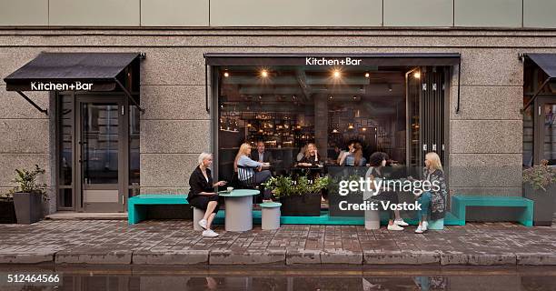 view of cafe from outside - cafe draußen stock-fotos und bilder