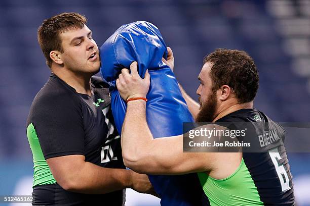 Offensive linemen Austin Blythe of Iowa and Evan Boehm of Missouri participate in a drill during the 2016 NFL Scouting Combine at Lucas Oil Stadium...