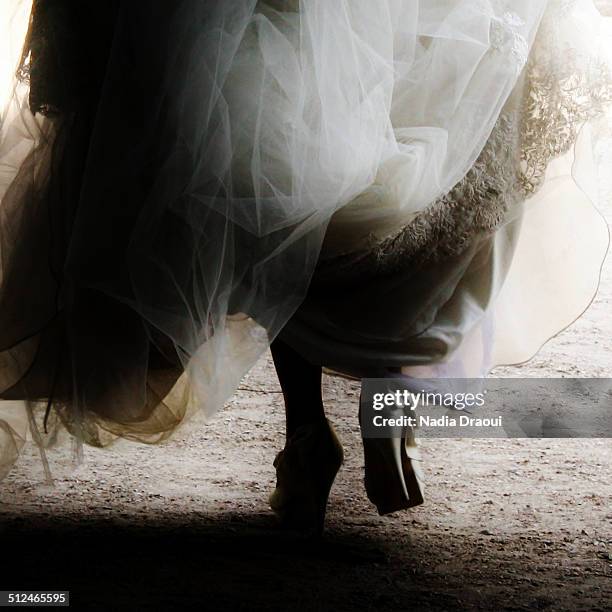 back view of a  bride walking - palais royal stockfoto's en -beelden