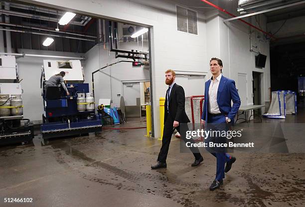 Adam Reid and Rory Rawlyk of Orlando Solar Bears leave the arena following a game on February 12, 2016 in Orlando, Florida.