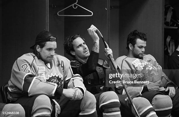 Johnny McInnis, Austin Block, and Matt Rupert of Orlando Solar Bears pause between periods of their game against the Atlanta Gladiators on February...