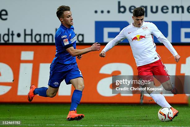 Mirnes Pepic of Paderborn challenges Marcel Sabitzer of Leipzig during the 2. Bundesliga match between SC Paderborn and RB Leipzig at Benteler Arena...