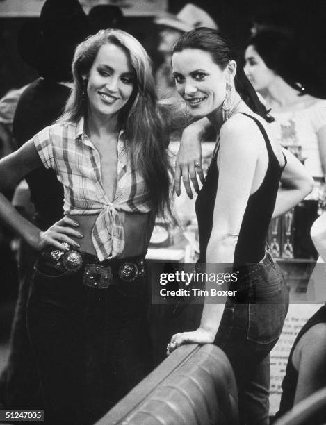 American model and actor Jerry Hall and her sister, Cindy, at a party for director James Bridges's film 'Urban Cowboy' held at Gilley's, Pasadena,...