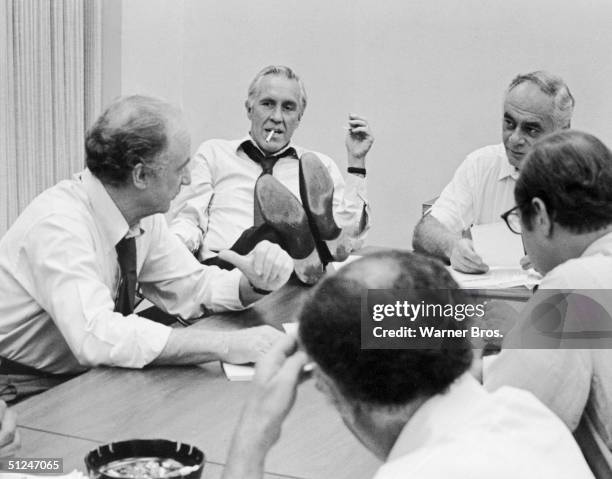 American actors, left to right, Jack Warden, Jason Robards , Martin Balsam and others have a meeting in a still from the film, 'All the President's...