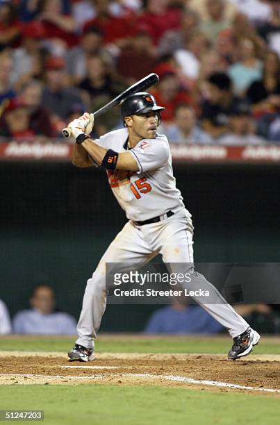 Infielder Jerry Hairston Jr. #15 of the Baltimore Orioles swings at an Anaheim Angels pitch during the game at Angel Stadium of Anaheim on August 11,...