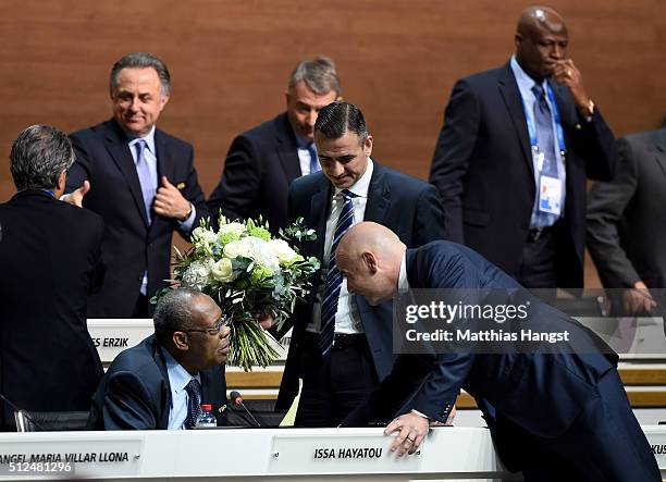 Newly elected FIFA President Gianni Infantino talks to Acting President Issa Hayatou with Acting Secretary General Markus Kattner during the...