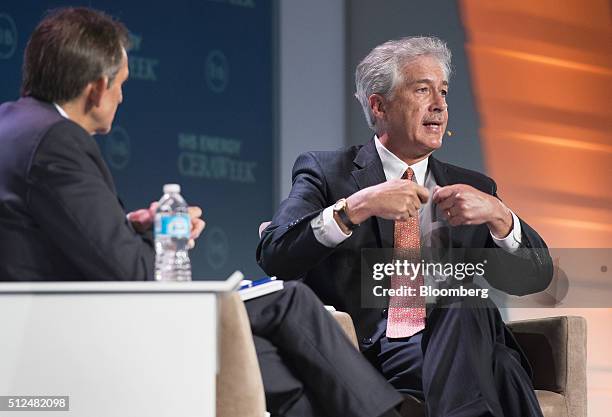 William Burns, president of the Carnegie Endowment for International Peace, right, speaks as Carlos Pascual, senior vice president of Global Energy...