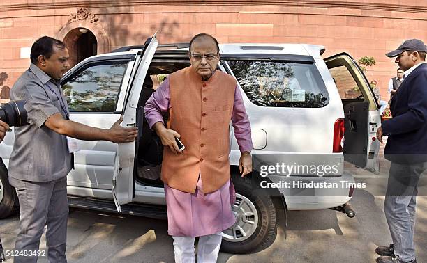 Finance Minister Arun Jaitley arrives to table Economic Survey 2015-16 at Parliament during the Budget Session on February 26, 2016 in New Delhi,...