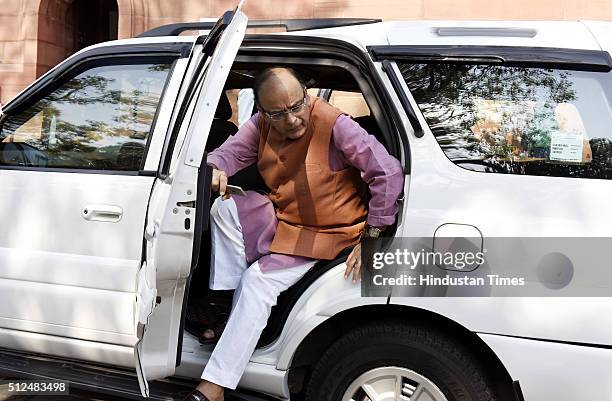 Finance Minister Arun Jaitley arrives to table Economic Survey 2015-16 at Parliament during the Budget Session on February 26, 2016 in New Delhi,...