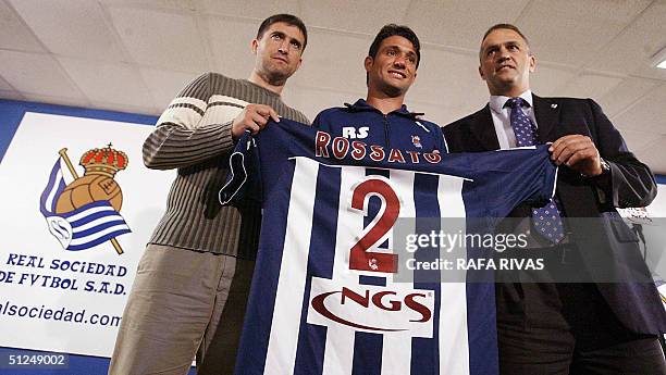 Real Sociedad Spanish football team's President Jose Luis Astiazaran and Technical Director Roberto Olabe , flank the new Real Sociedad player,...