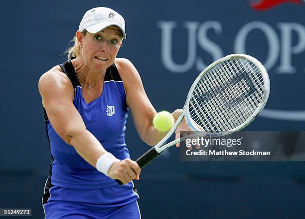 Lisa Raymond returns a shot to Alina Jidkova of Russia during the US Open August 31, 2004 at the USTA National Tennis Center in Flushing Meadows...