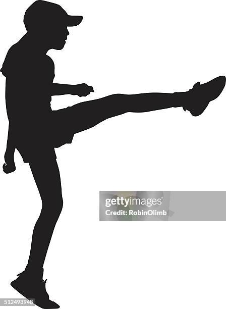 girl doing high kick silhouette - kickboxing stock illustrations