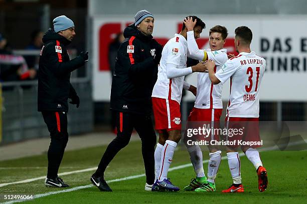 Marvin Compper of Leipzig celebrates the first goal with Dominik Kaiser and Diego Demme of Leipzig during the 2. Bundesliga match between SC...