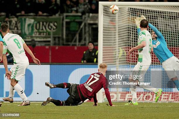 Sebastian Kerk of Nuernberg scores his team's first goal past goalkeeper Sebastian Mielitz of Fuerth during the Second Bundesliga match between 1. FC...