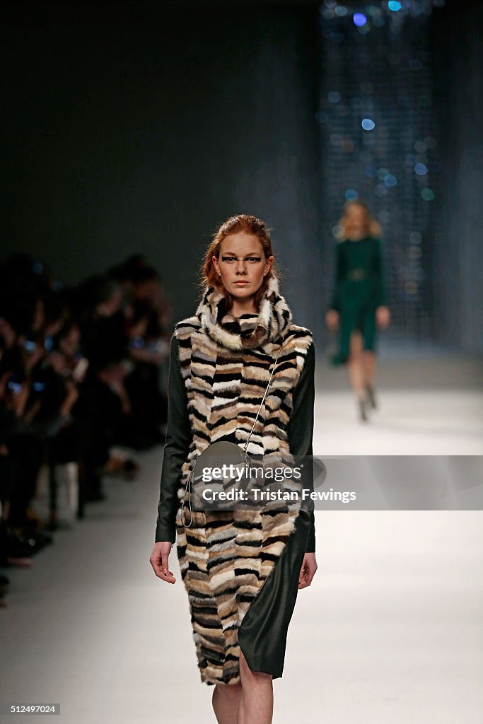 A model walks the runway at the Aigner show during Milan Fashion Week ...