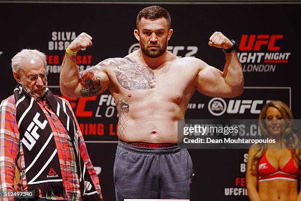 Daniel Omielanczuk of Poland poses on the scales on stage during the UFC Fight Night Weigh-in held at at Indigo at The O2 Arena on February 26, 2016...