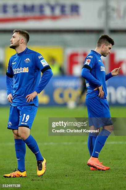 Marc Brasnic and Moritz Stoppelkamp of Paderborn look dejected after the 2. Bundesliga match between SC Paderborn and RB Leipzig at Benteler Arena on...