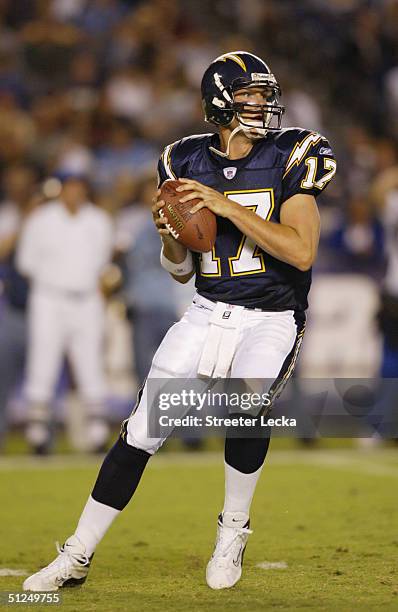 Quarterback Philip Rivers of the San Diego Chargers drops back to pass against the Seattle Seahawks at Qualcomm Stadium on August 27, 2004 in San...