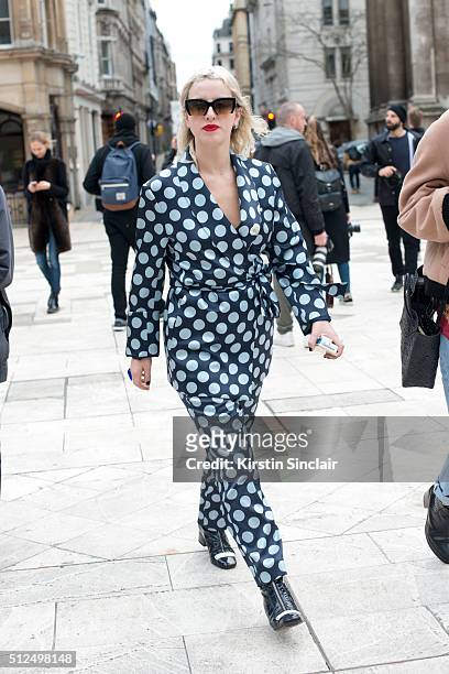 Love senior editor Harriet Verney wears Dora Tamer shoes and Miu Miu sunglasses on day 3 during London Fashion Week Autumn/Winter 2016/17 on February...