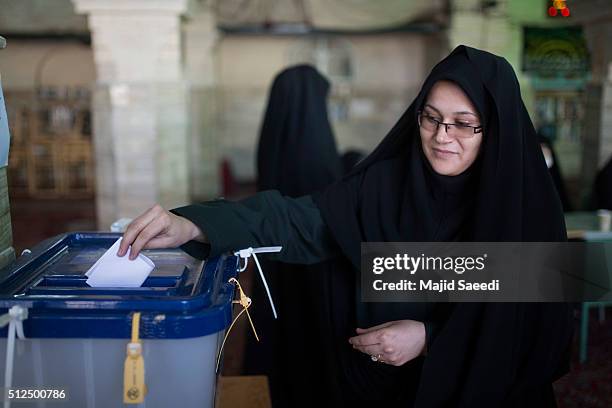 Woman votes in the parliamentary and Experts Assembly elections at a polling station on February 26, 2016 in Qom, 125 kilometers south of the capital...
