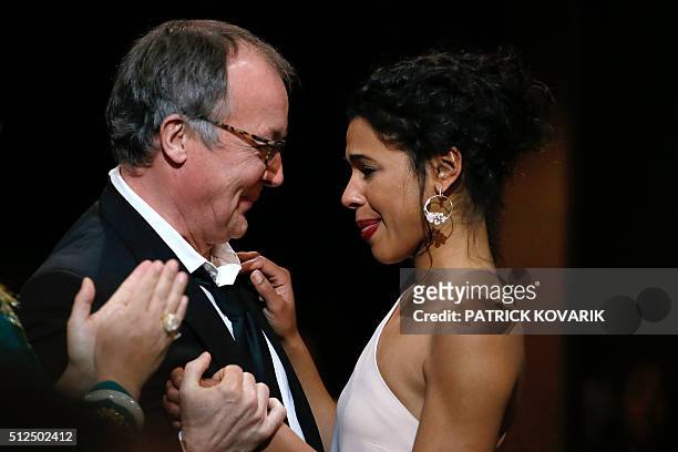 French actress Zita Hanrot is congratulated by French director Philippe Faucon after winning the Best Female Newcomer award for "Fatima" during the...