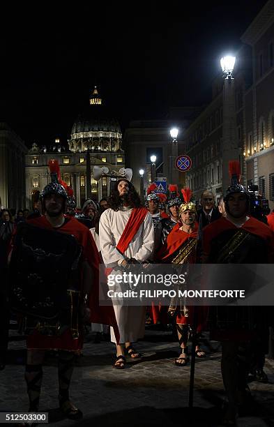 Men reenact the way of the cross by Jesus Christ on Via della Conciliazione leading from St.Peter's Basilica at the Vaticano in Rome on February 26,...