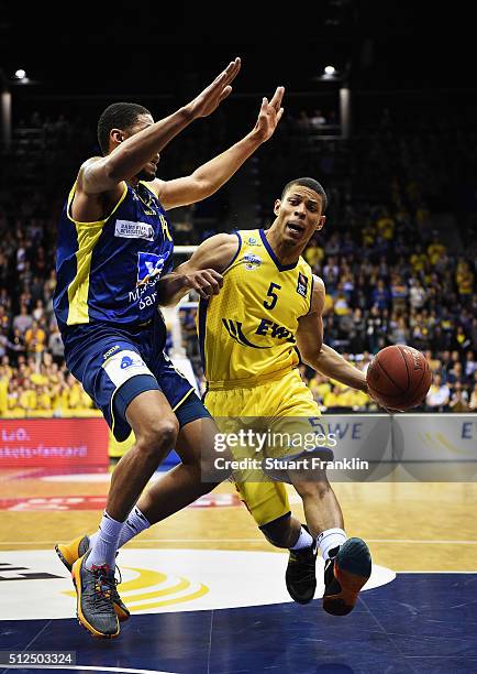 Scott Machado of Oldenburg is challenged by Moritz Krume of Hagen during the Bundesliga basketball match between EWE Baskets Oldenburg and Phoenix...