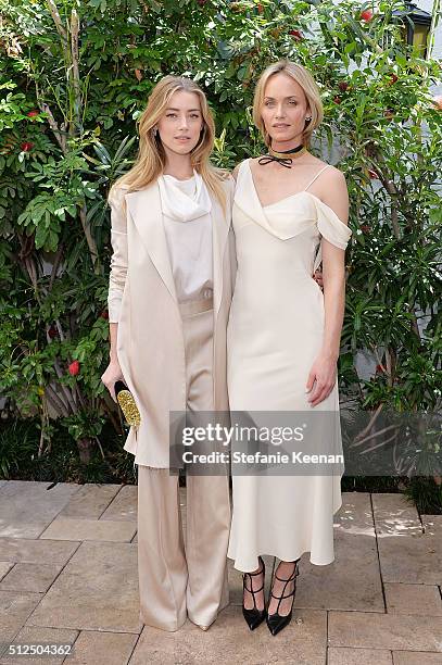 Actress Amber Heard and model Amber Valletta attend NET-A-PORTER Celebrates Women Behind The Lens at Chateau Marmont on February 26, 2016 in Los...