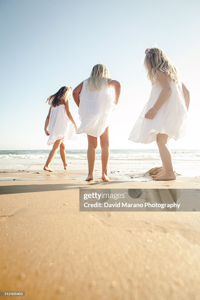 3 girls playing at beach